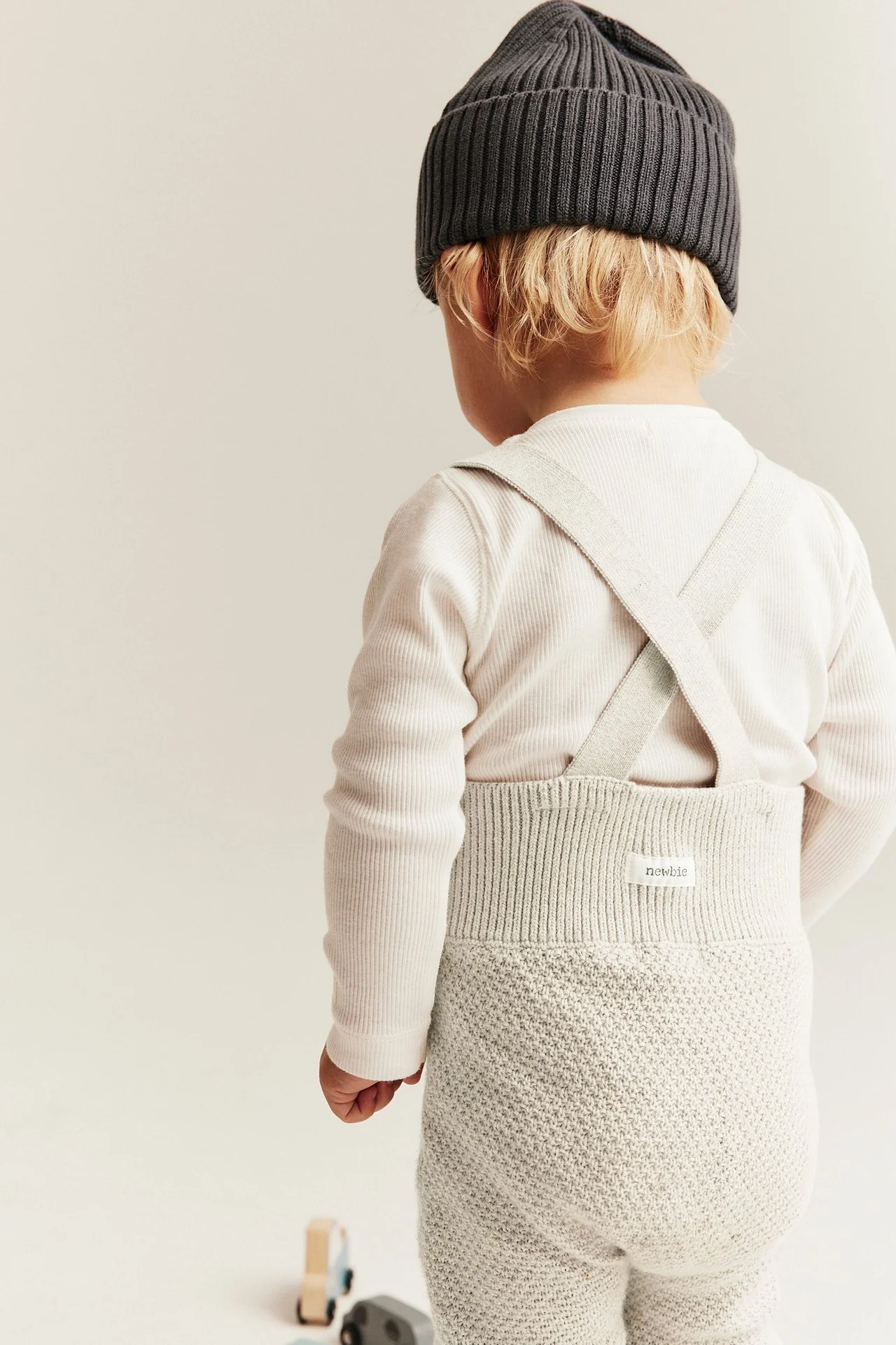 Baby beige knitted dungarees - Image 3