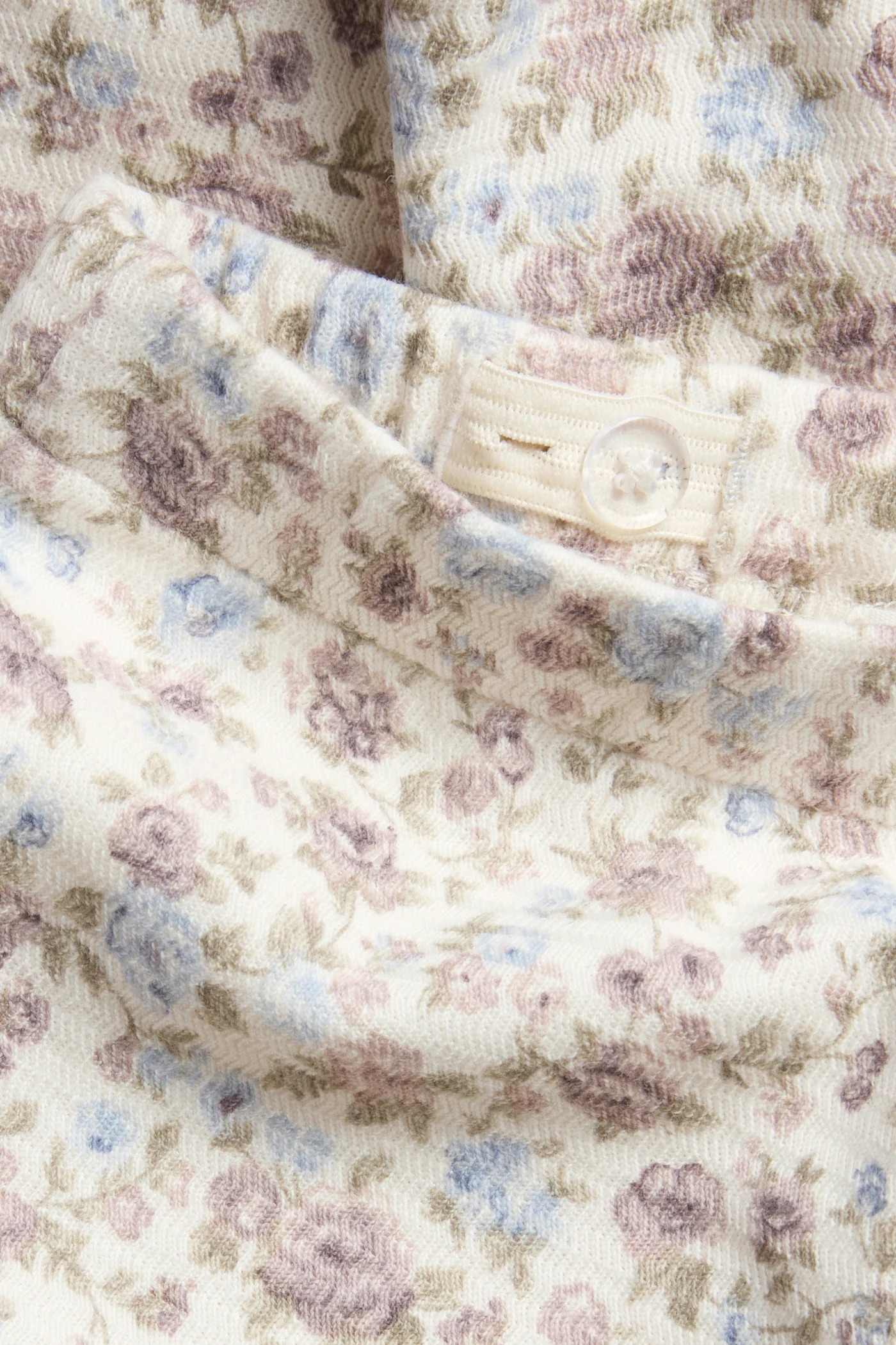 Kids' white floral jersey trousers with frill - Image 2