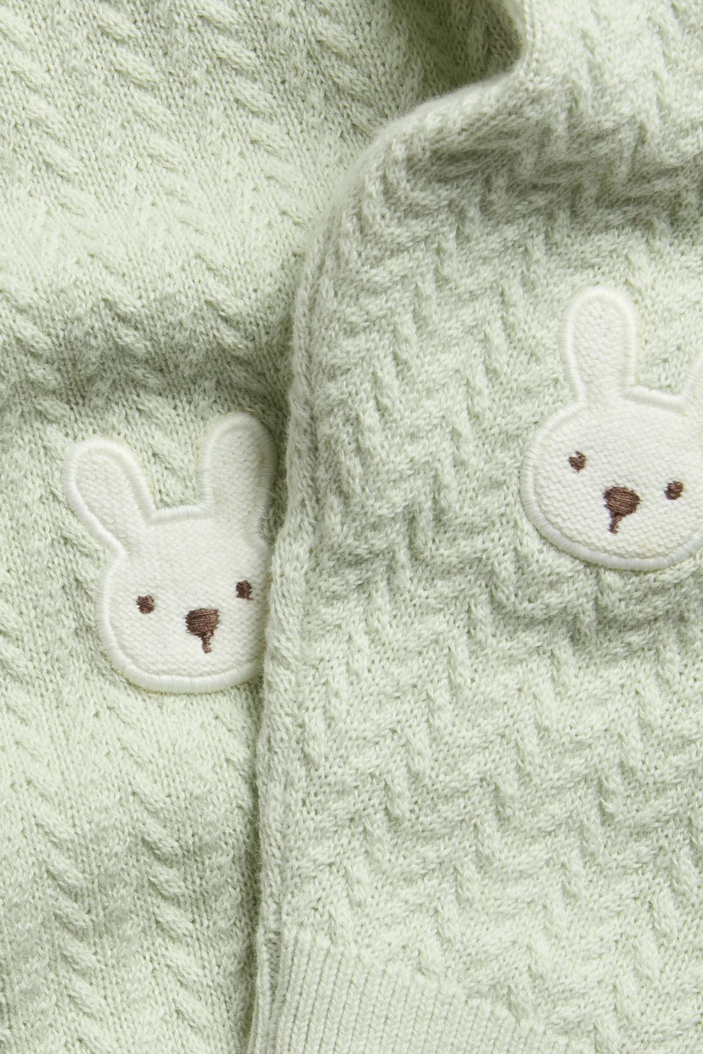 Baby green knitted leggings with rabbit appliqué - Image 2