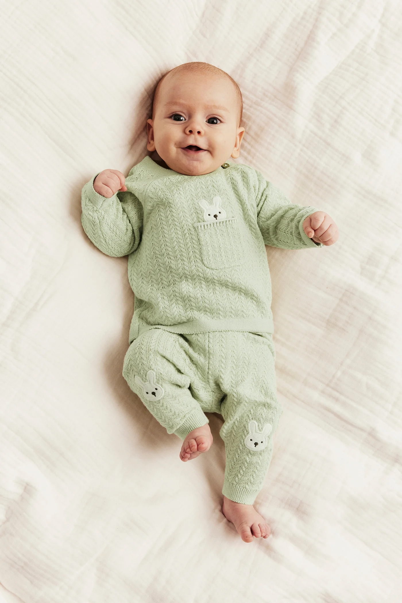 Baby green knitted leggings with rabbit appliqué - Image 3