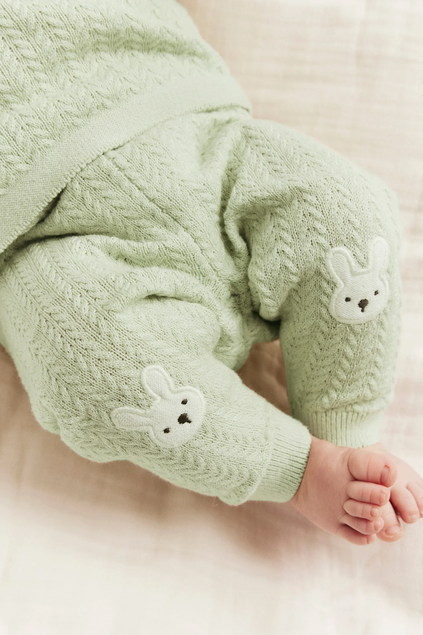 Baby green knitted leggings with rabbit appliqué - Image 4