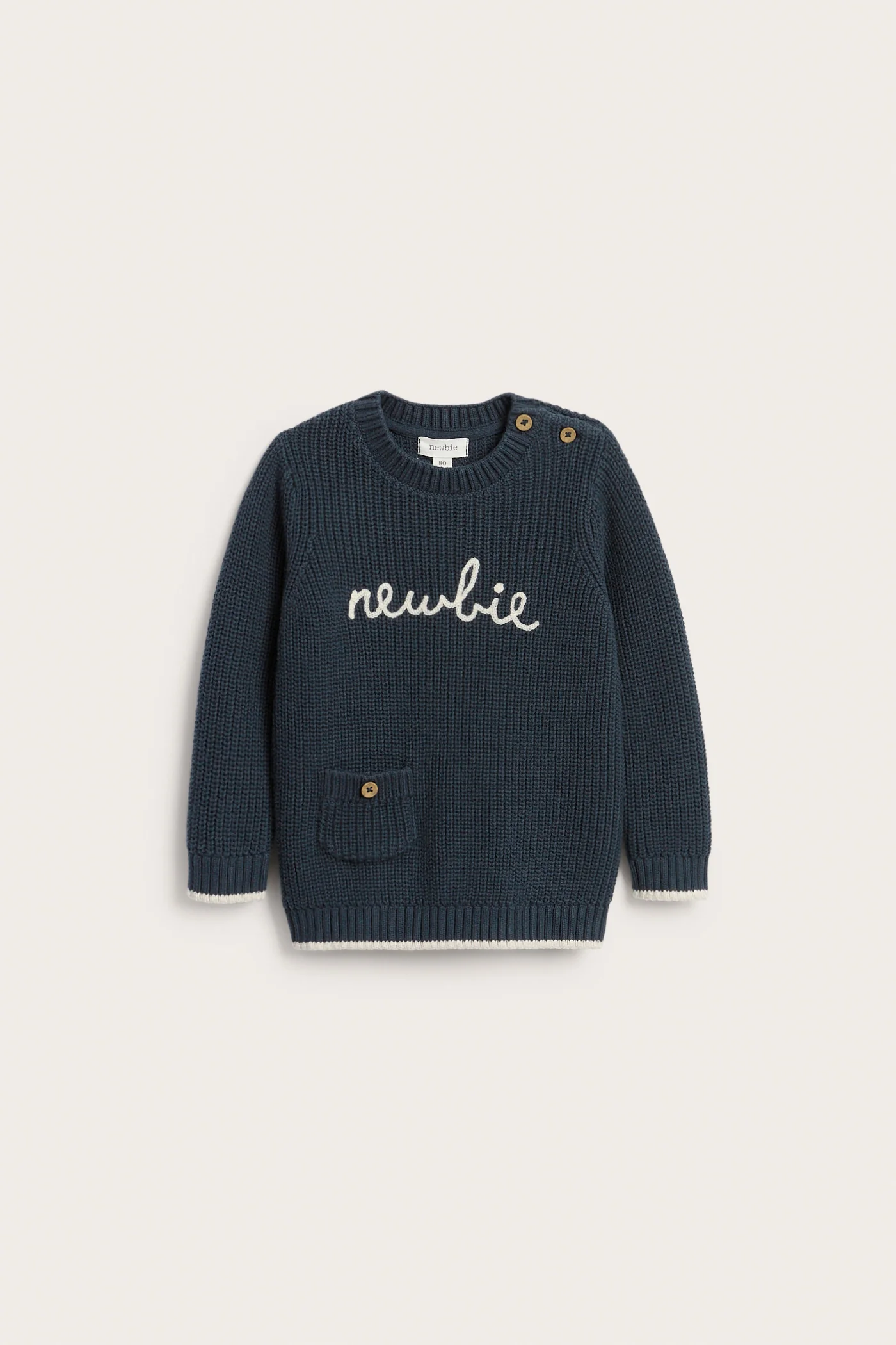 Baby blue knitted jumper with Newbie logo