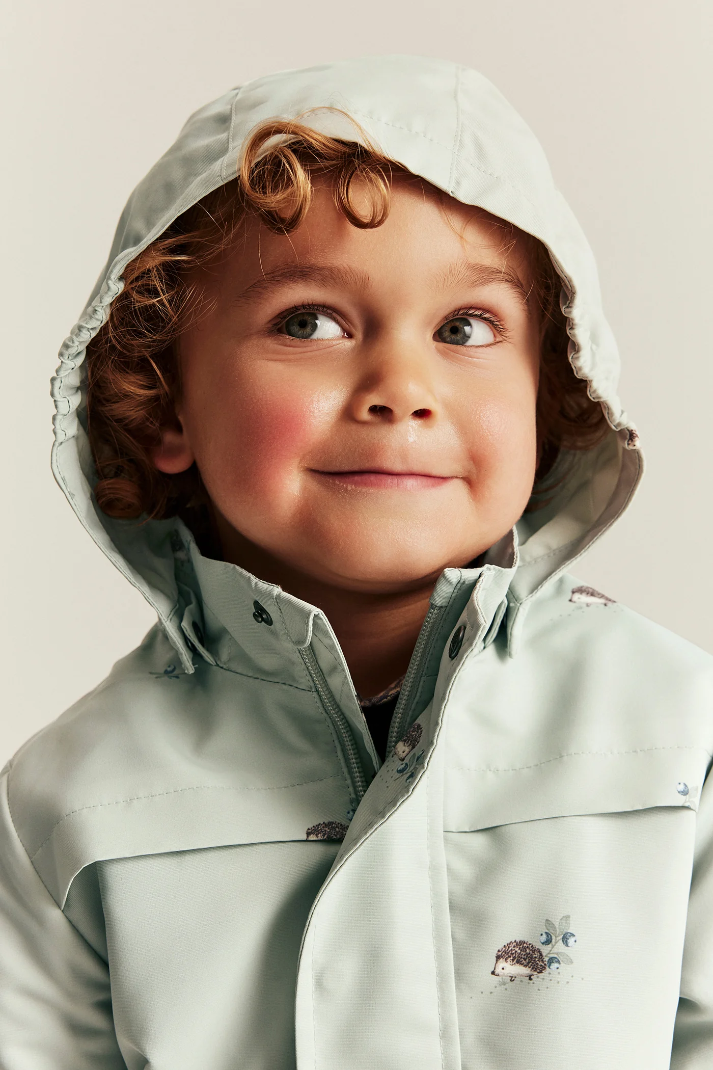 Baby & kids’ green windproof jacket with hedgehogs - Image 3