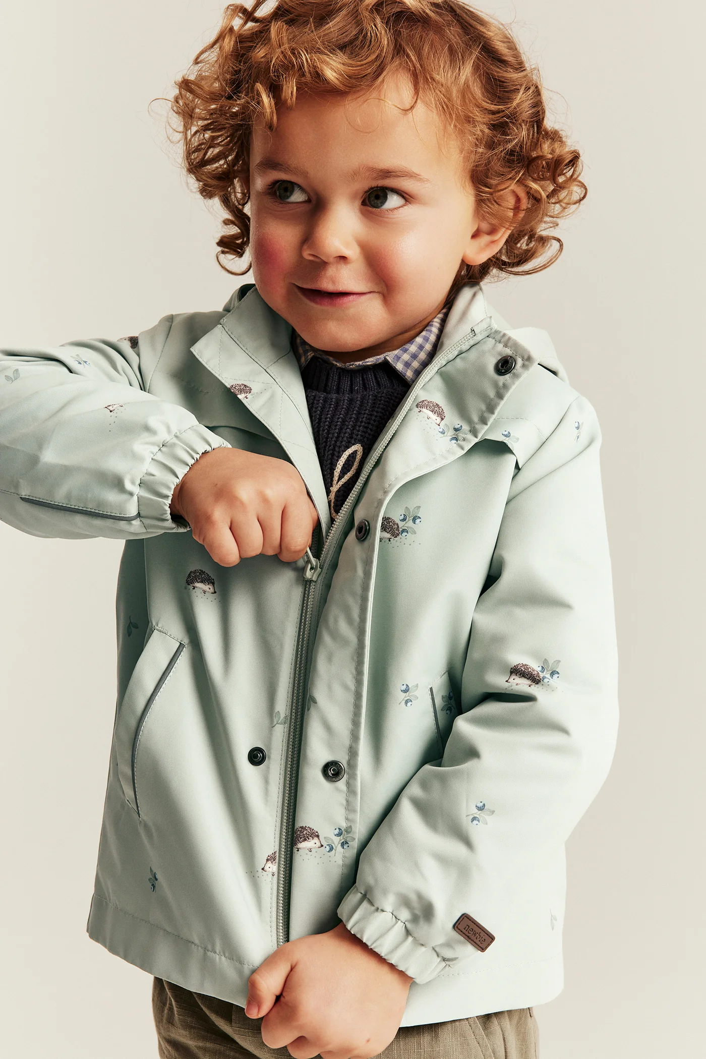 Baby & kids’ green windproof jacket with hedgehogs - Image 5