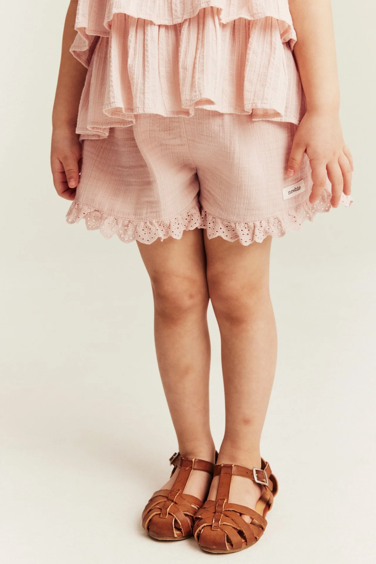 Kids pink woven shorts with frill - Image 3