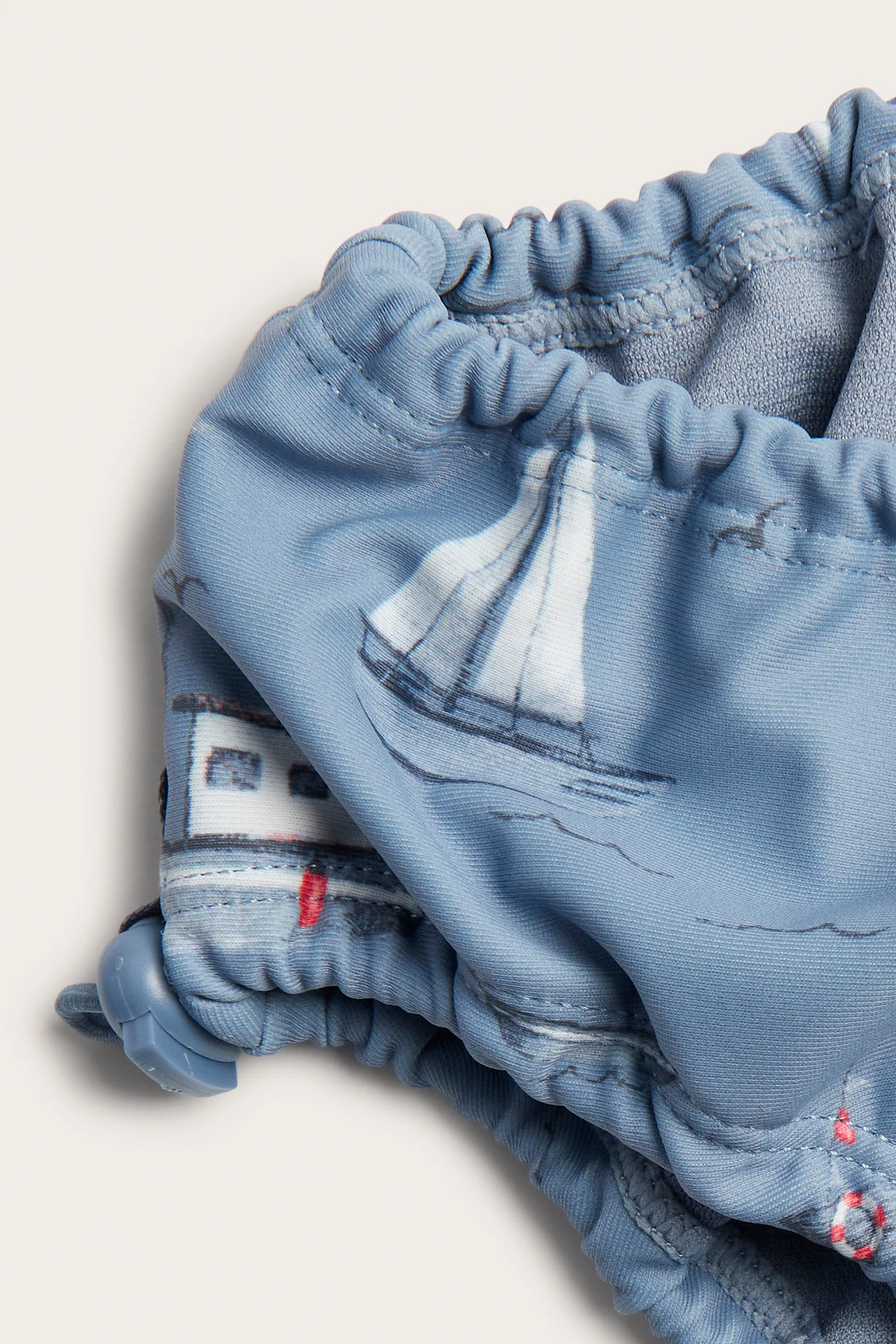 Baby & kids blue swim bottoms with boat motif - Image 2