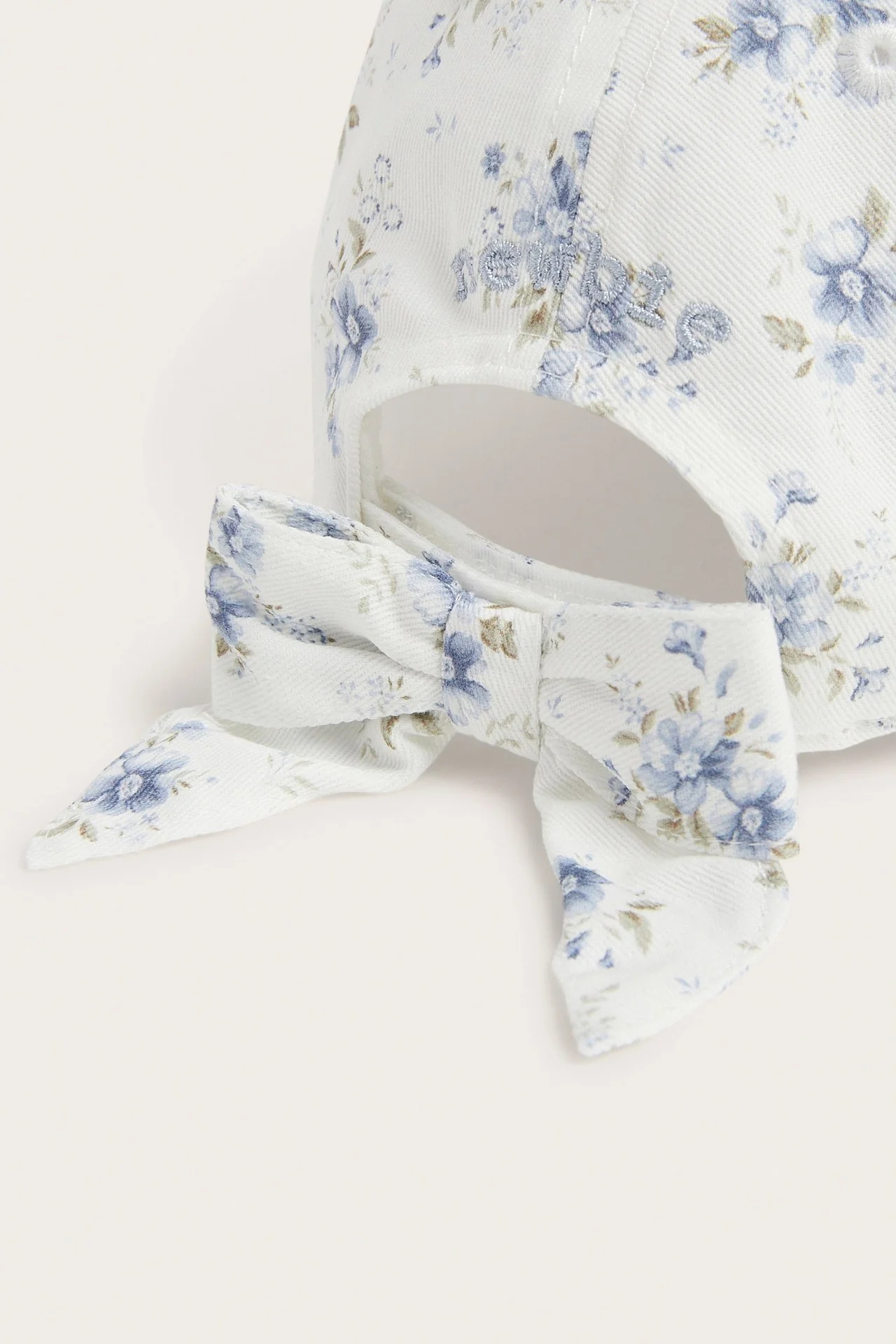 Baby white floral cap with bow - Image 2