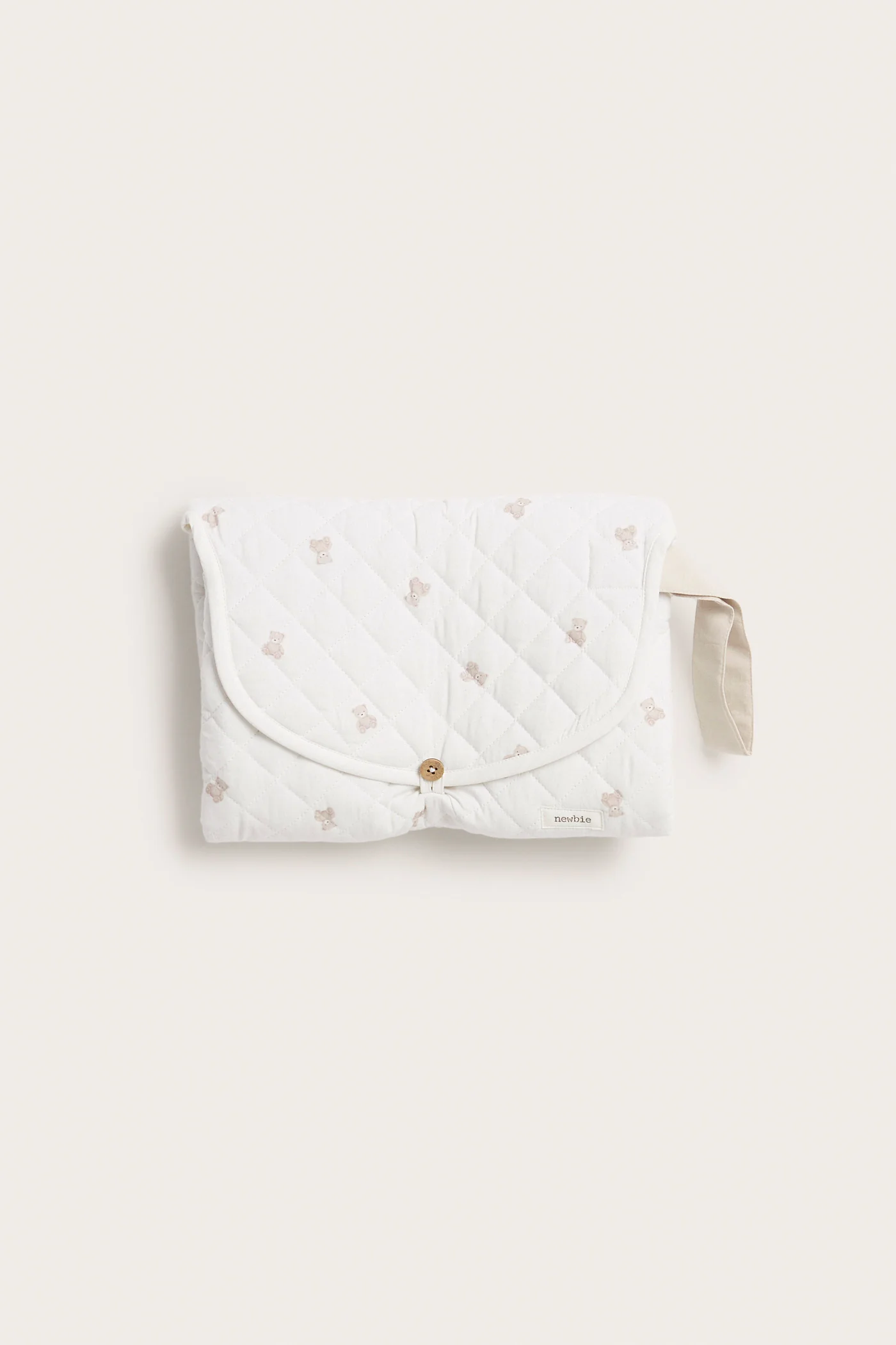 Foldable white changing mat with teddy bears